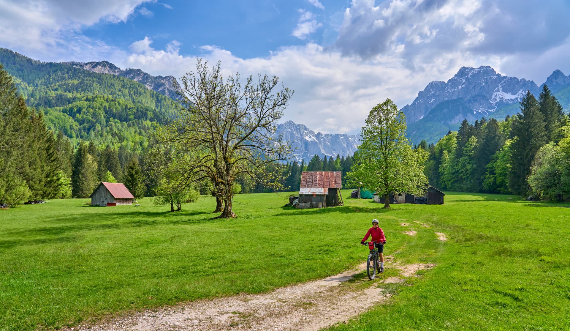 active senior woman on a mountain bike tour in the Julian Alps above Kranska Gora in Slovenia